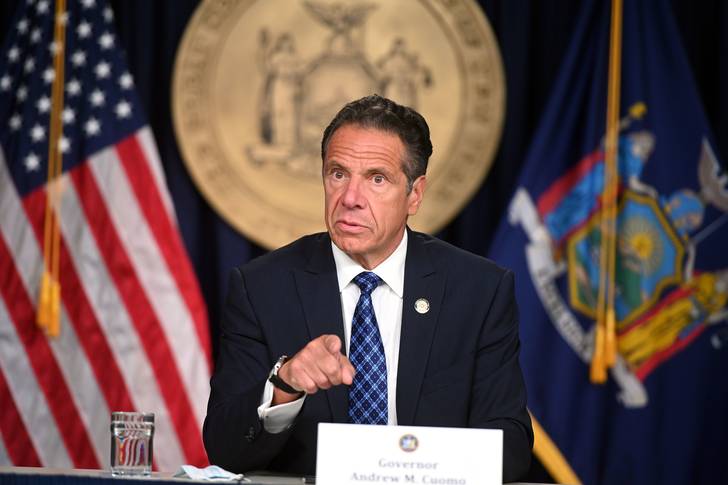 Governor Andrew M. Cuomo, seated and pointing at the camera, delivers a COVID-19 Coronavirus update in New York City Monday August 17, 2020.
